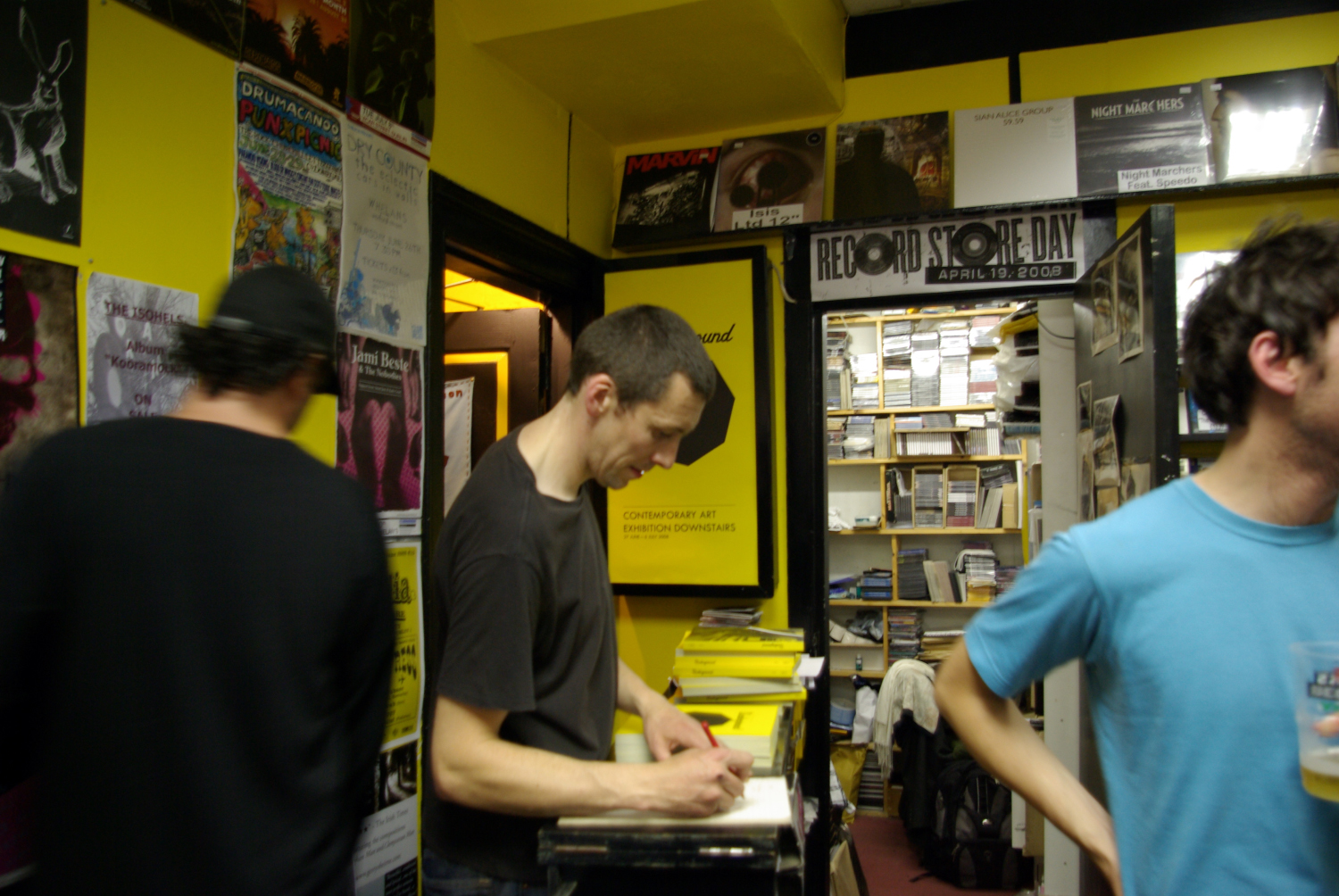 <p>‘I stand behind the counter and sell 150 copies of our book’. <em>Underground</em> (2008), exhibition launch, ROAD Records, Dublin. (Photograph: McNulty, D.).</p>